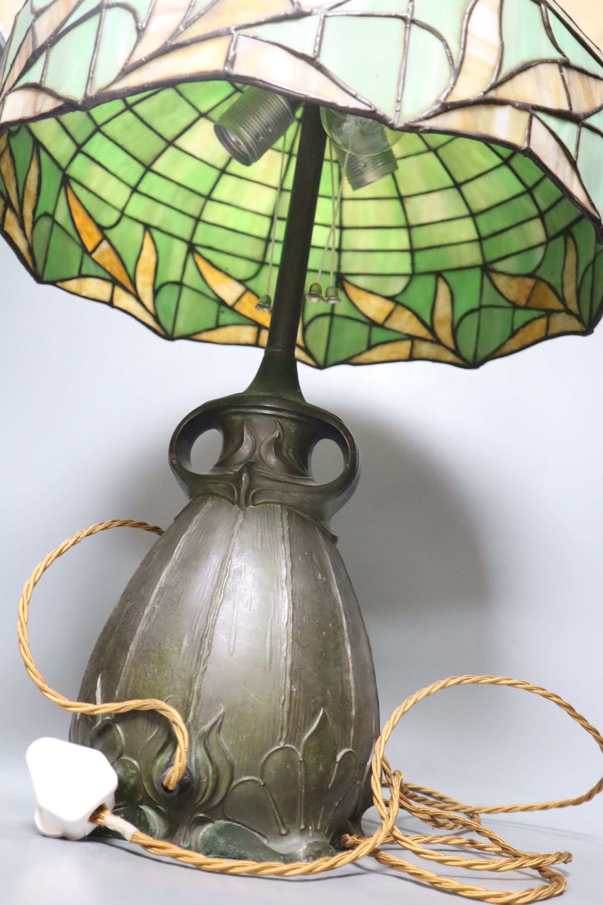 A spelter lamp with Tiffany style shade